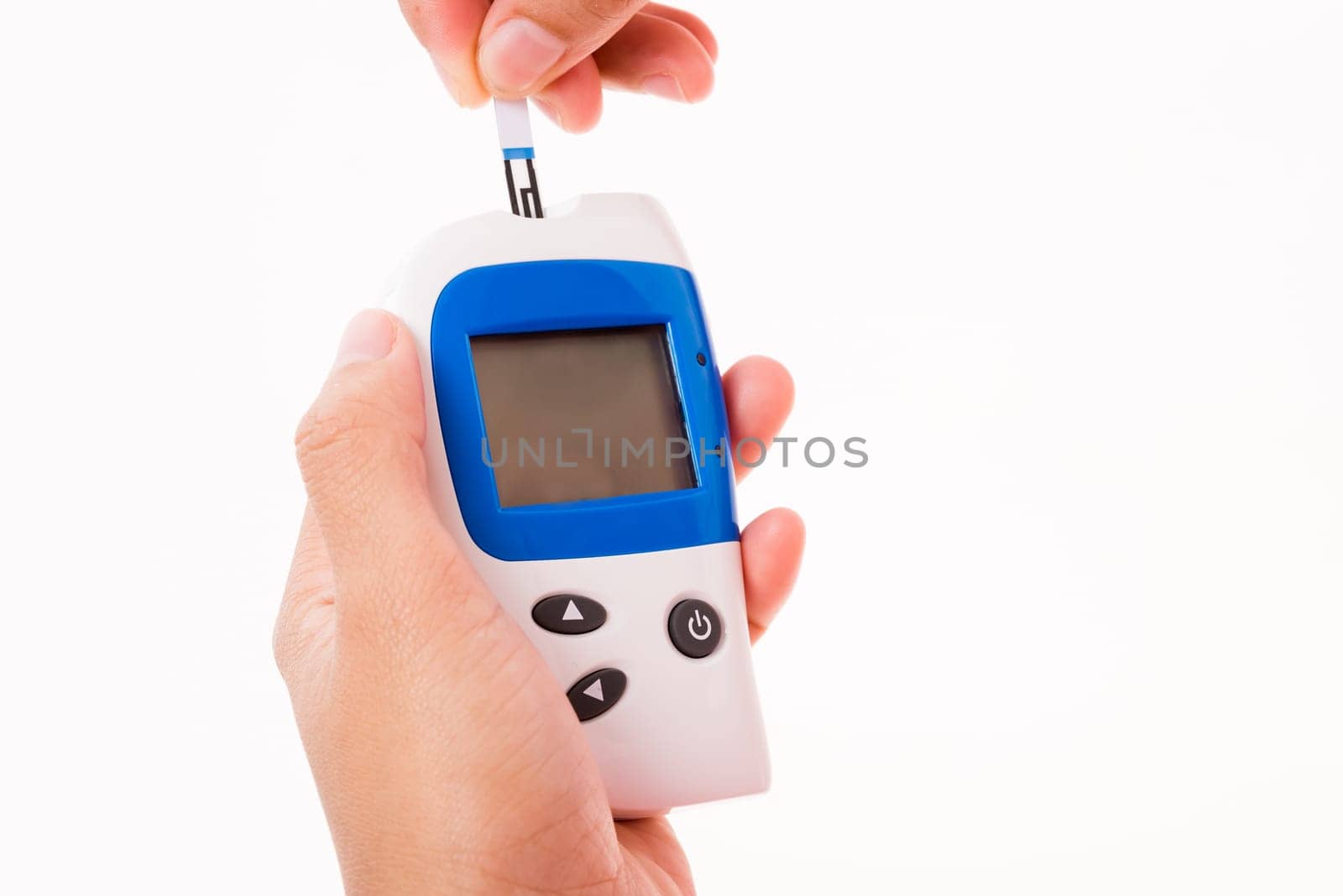 Closeup hands woman measuring glucose test level checking on a finger by glucometer she monitors and controls high blood sugar diabetes and glycemic health care concept isolated on white background