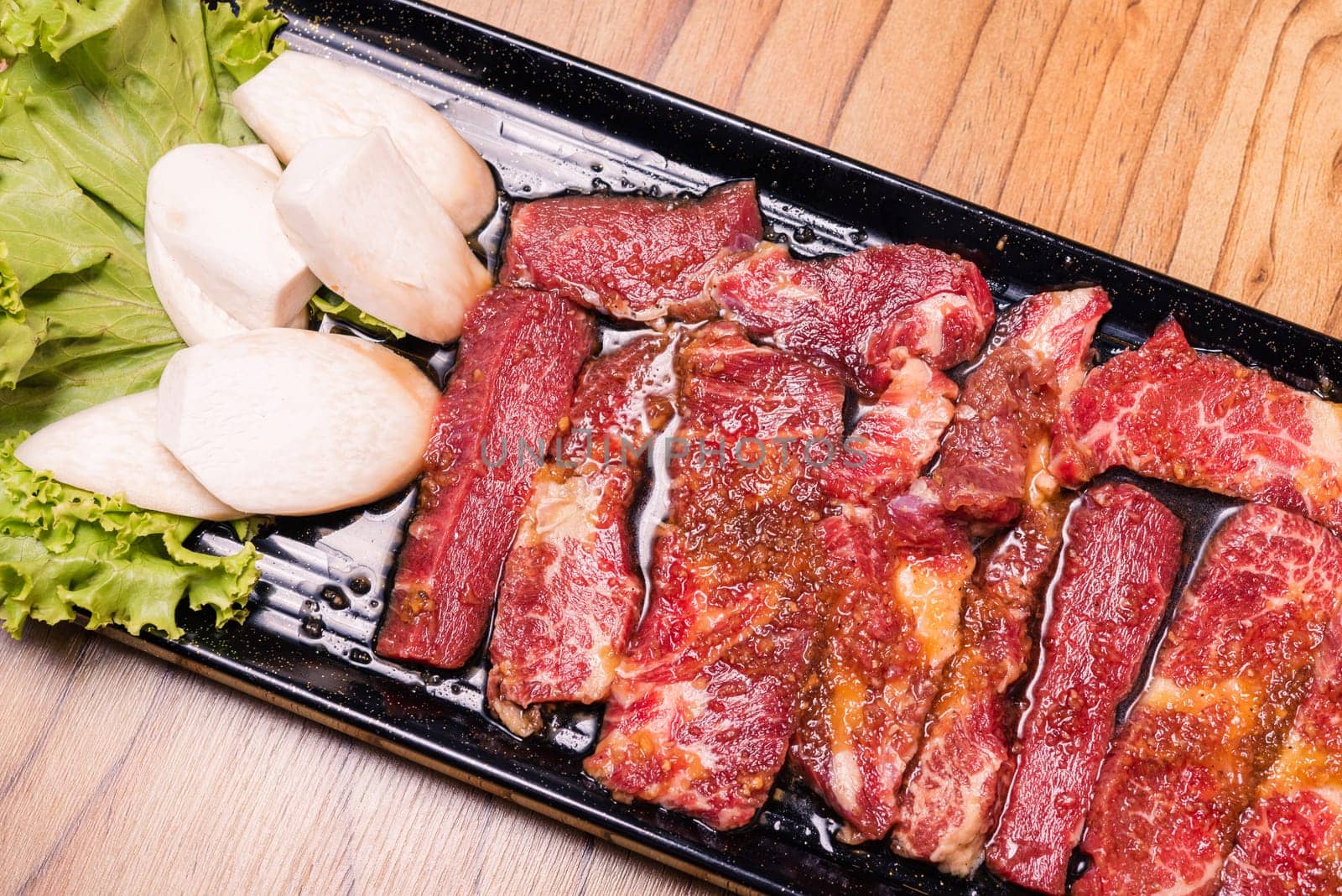 Raw pork on plate, Korean traditional style fresh pork beef belly BBQ, Japanese meat hot pot or Shabu in the restaurant, barbecue food