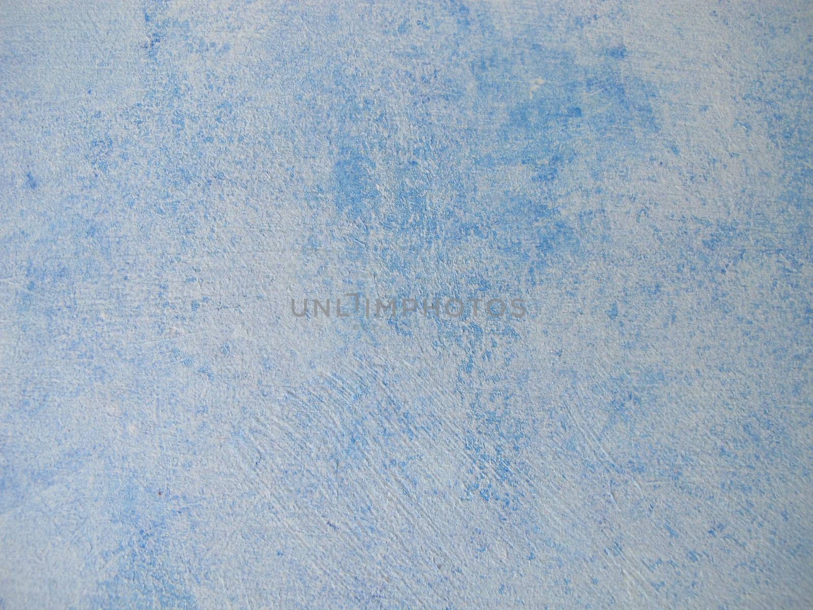 Wood painted with blue chalk paint and paint roller in vintage style