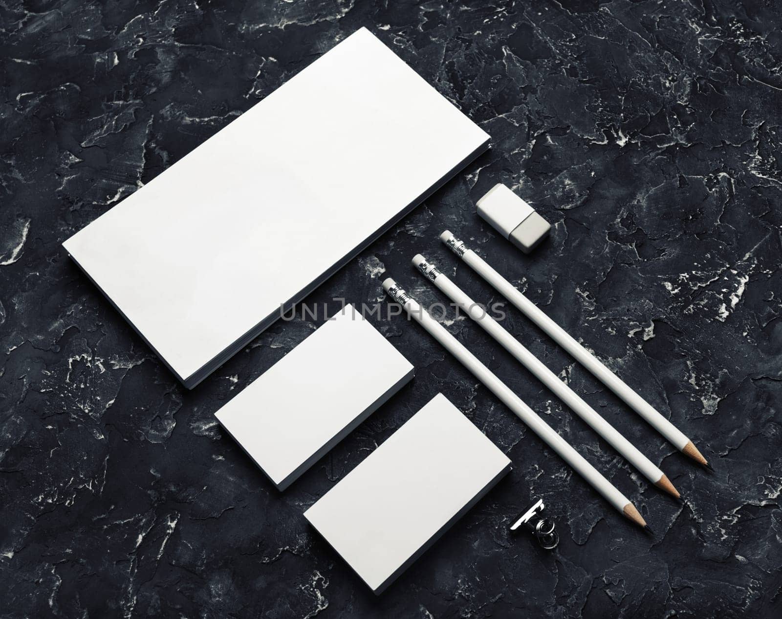 Brand identity mockup. Blank corporate stationery set on black plaster background.