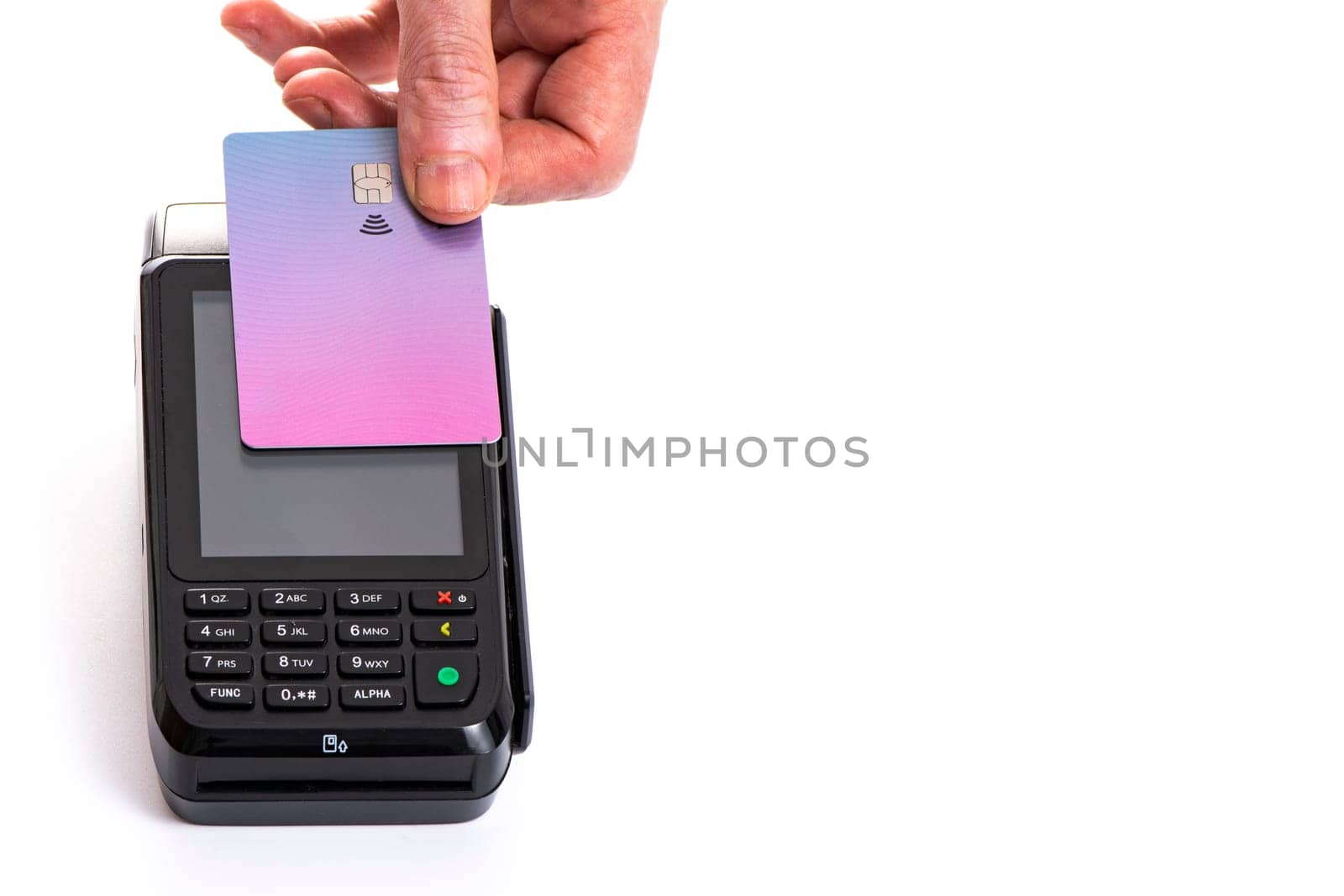 Attached plastic card to the payment terminal with a man's hand on a white isolated background, copy space. High quality photo