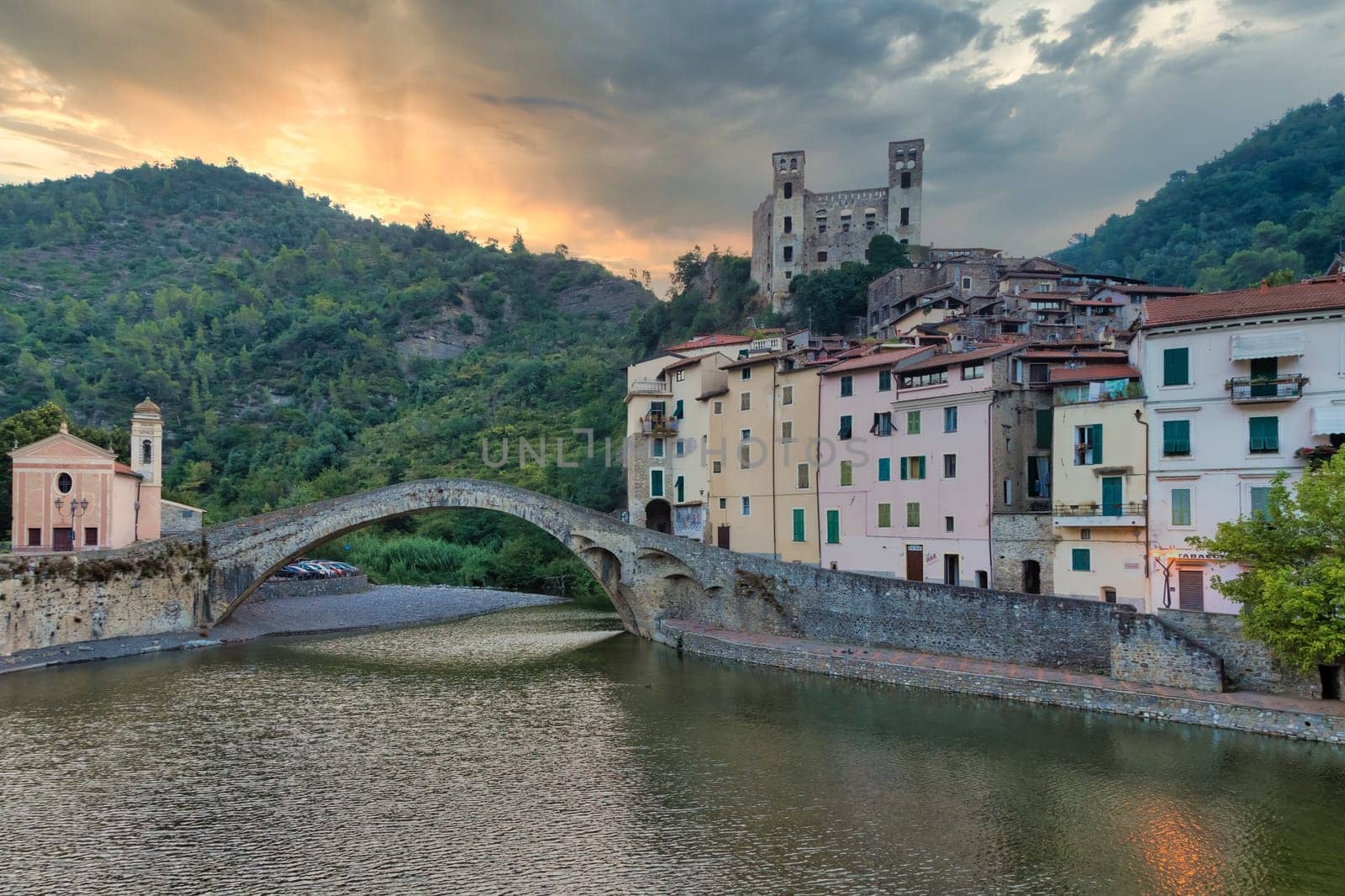 DOLCEACQUA, ITALY - CIRCA AUGUST 2020: Dolceacqua panorama with the ancient roman bridge made of stones and the castle