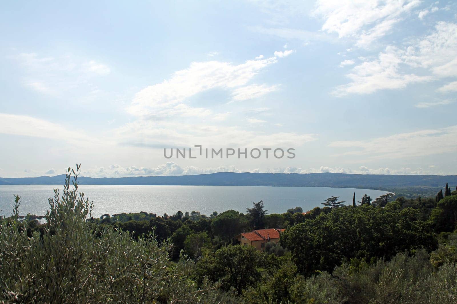 A panoramic view of Lake Trasimeno with trees in the south of Italy