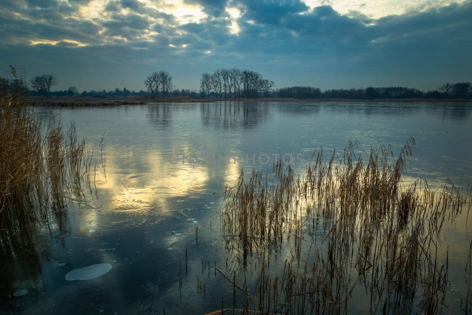 Reflection of the sky on a frozen lake, Stankow, Poland