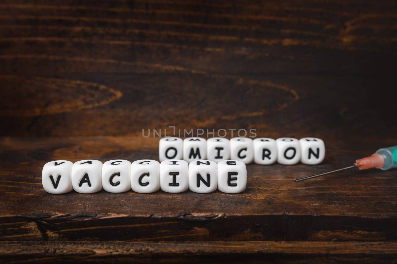 Corona virus Covid-19 vaccine text on wooden background