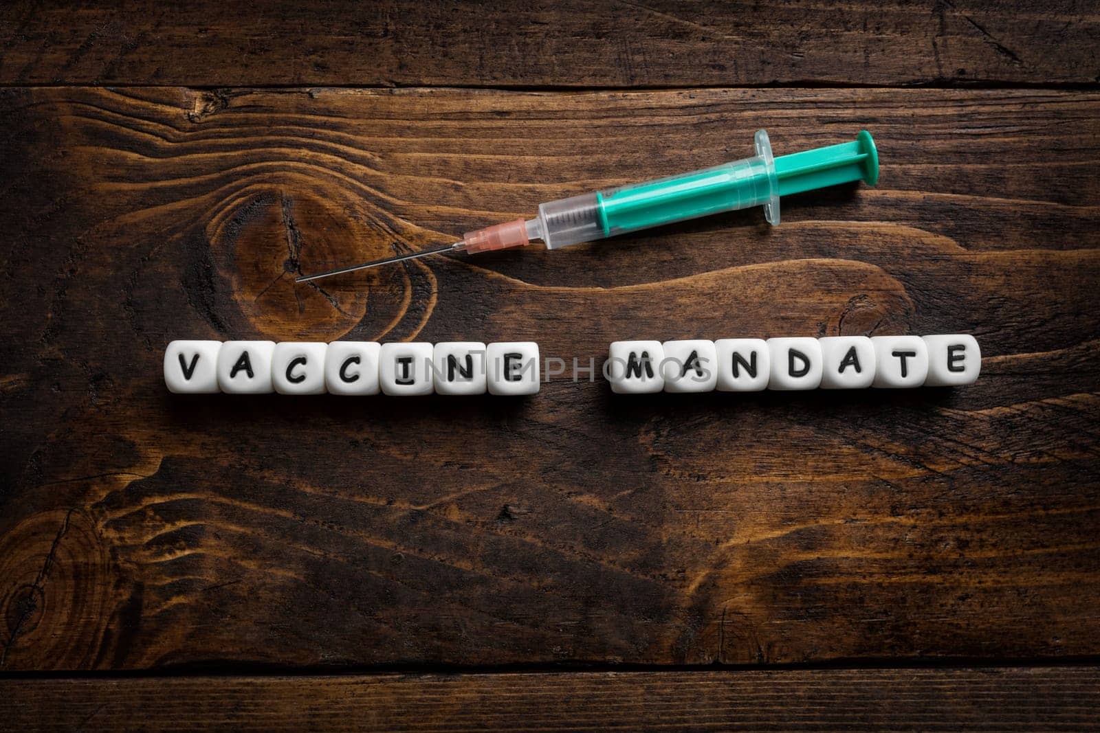 Corona virus Covid-19 vaccine text on wooden background