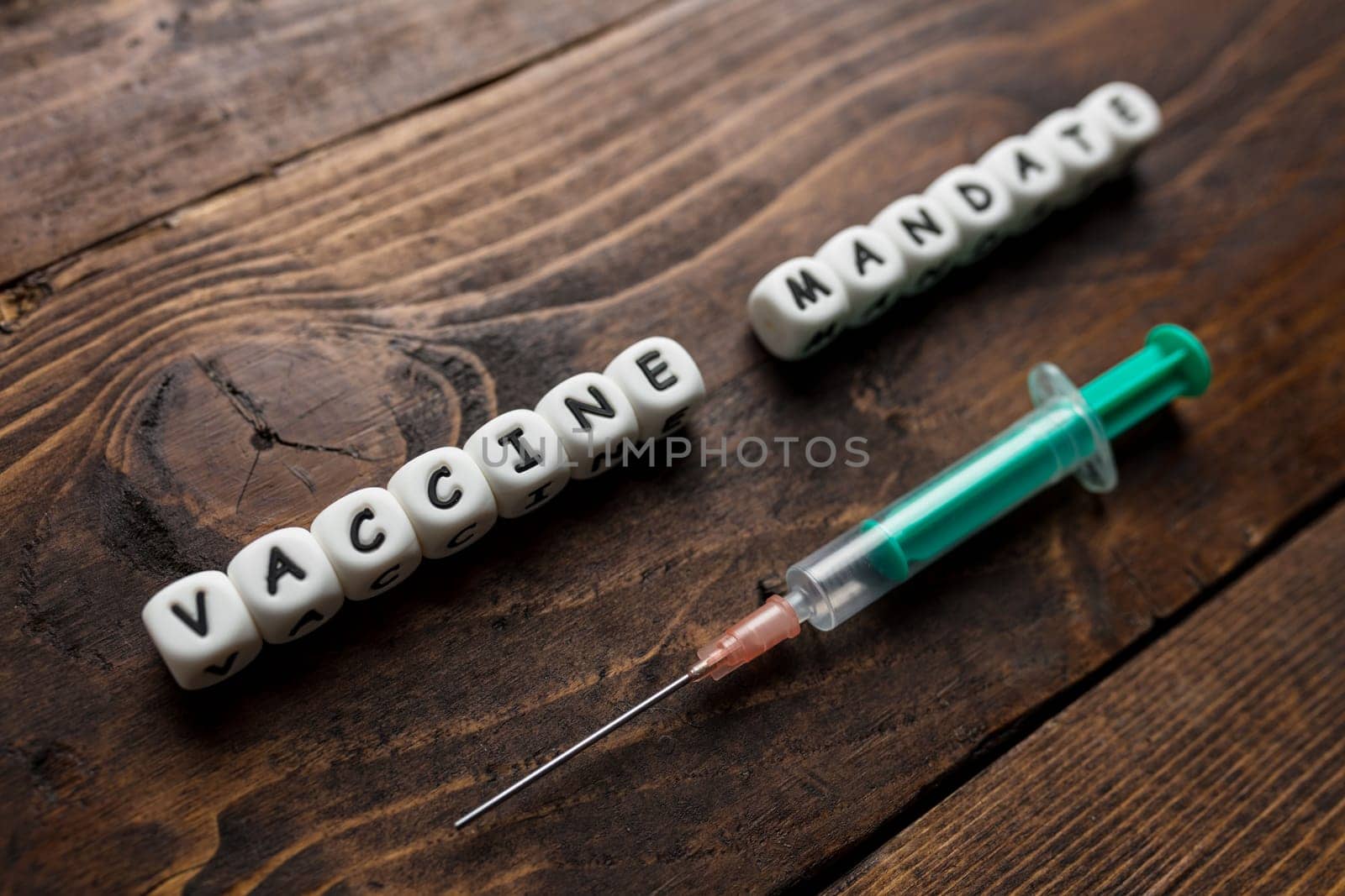 Corona virus Covid-19 vaccine text on wooden background