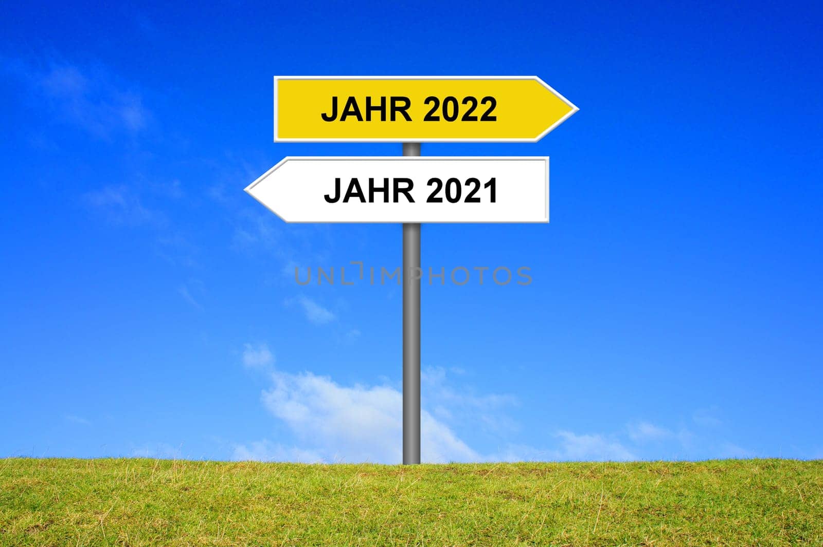 Signpost yellow and white showing year 2021 and year 2022 in german language