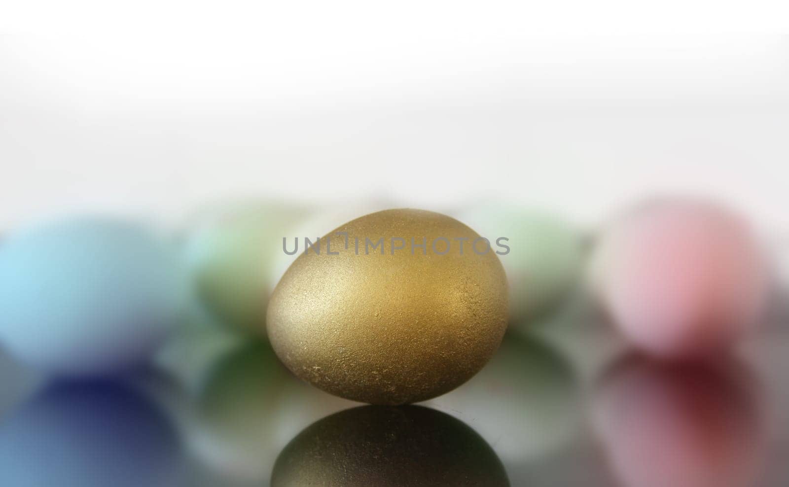 close up of golden and colored easter eggs