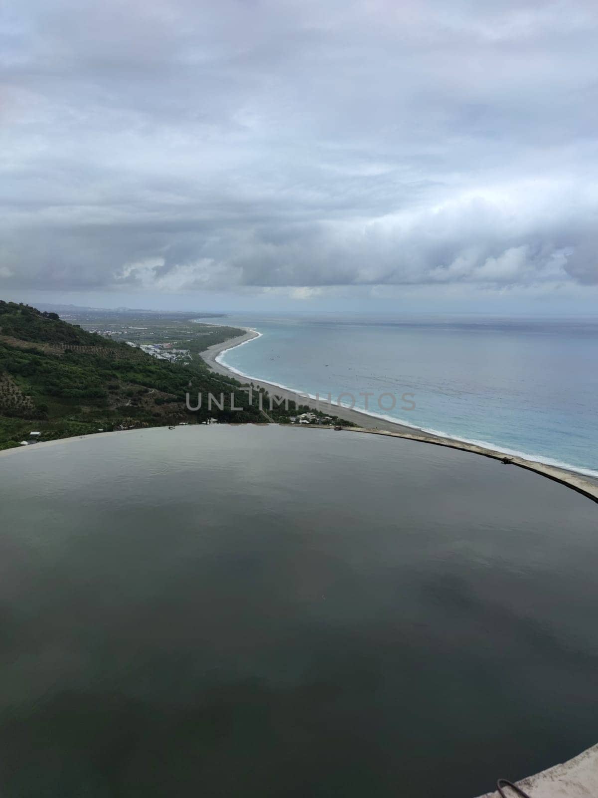 The Landscape View Of The Beautiful Eastern Coastline With Blue Sky And Water Tower Reflection From Huayuan Observation Deck, Taimali, Taitung