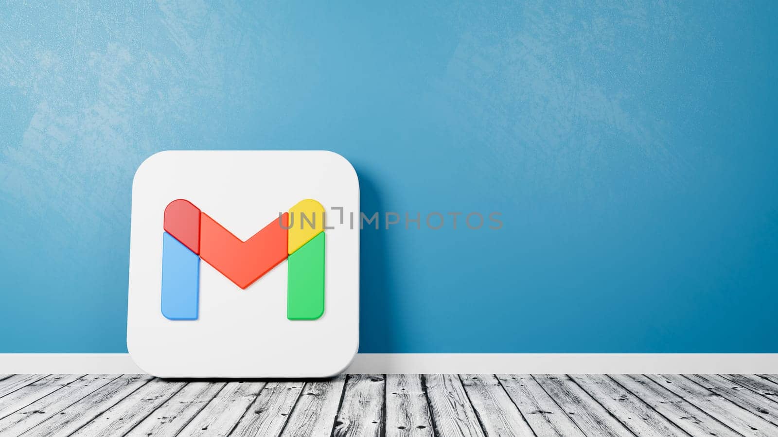 Gmail App Icon 3D Symbol Shape on Wooden Floor Against Blue Wall with Copy Space 3D Render Illustration
