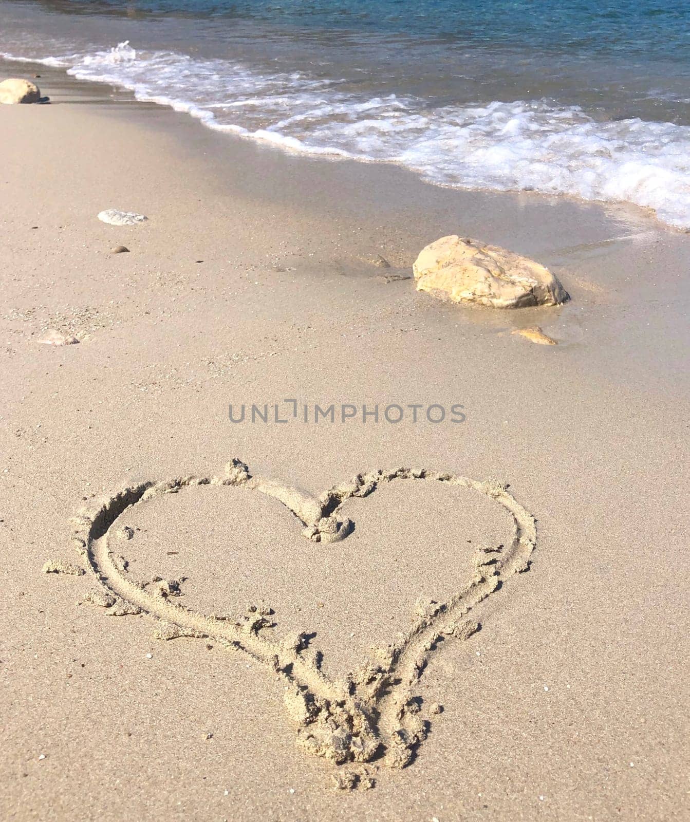 Heart in the sand on the beach in the south of France