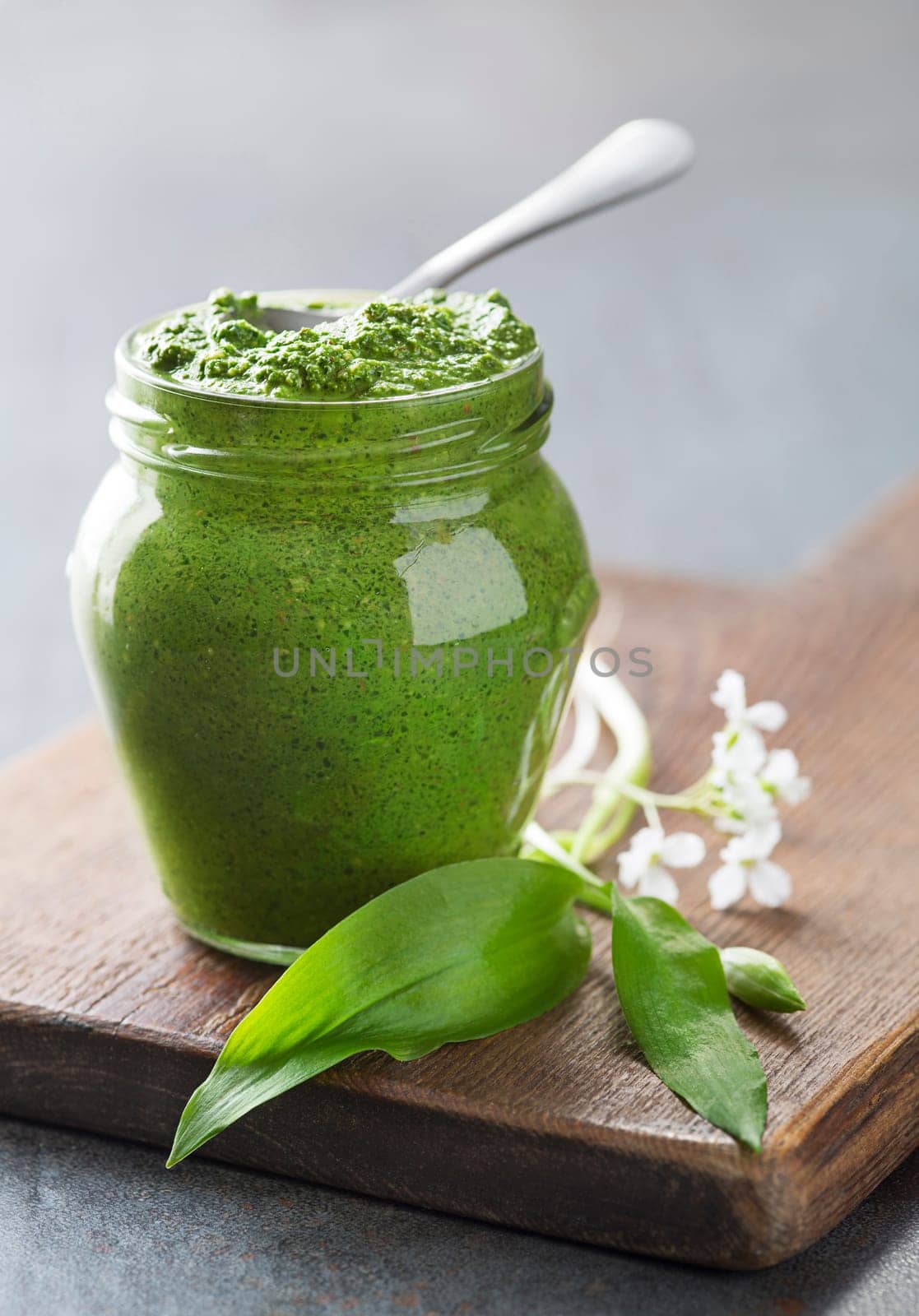 Fresh ramson or wild garlic pesto close up. Healthy spring food concept