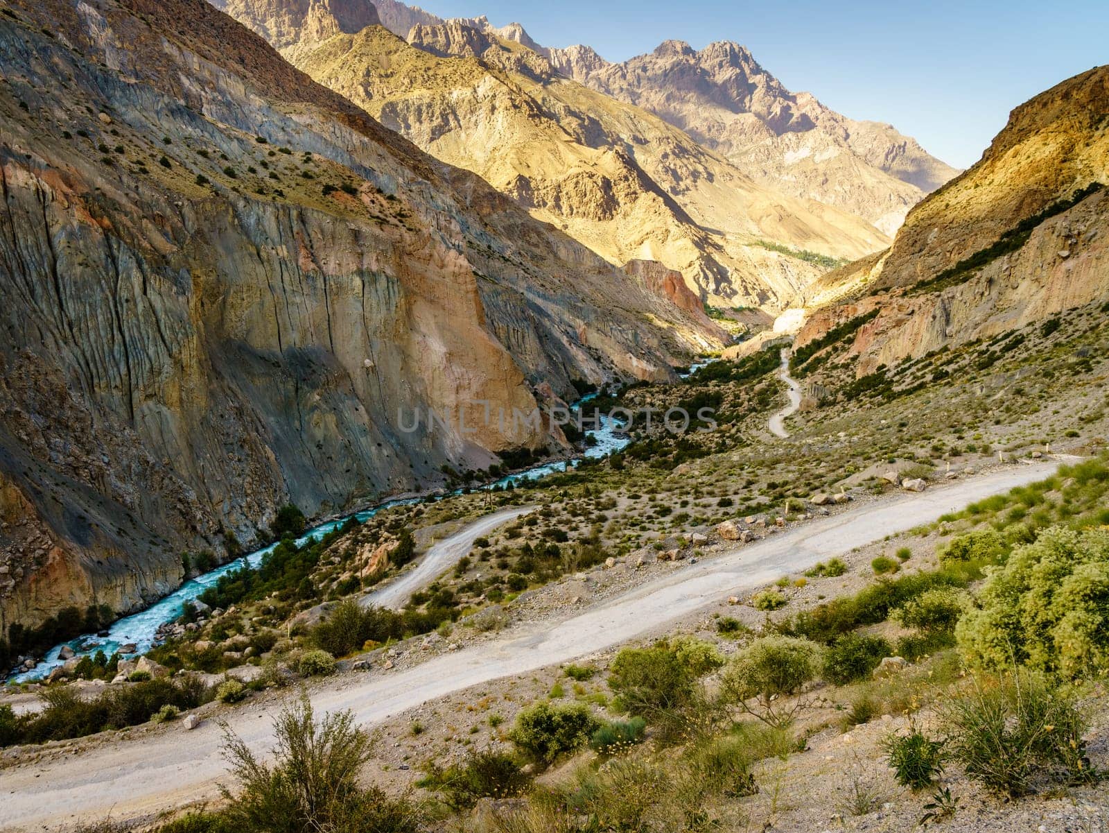 Scenic mountain road to Iskanderkul - an alpine lake in the mountains of Tajikistan