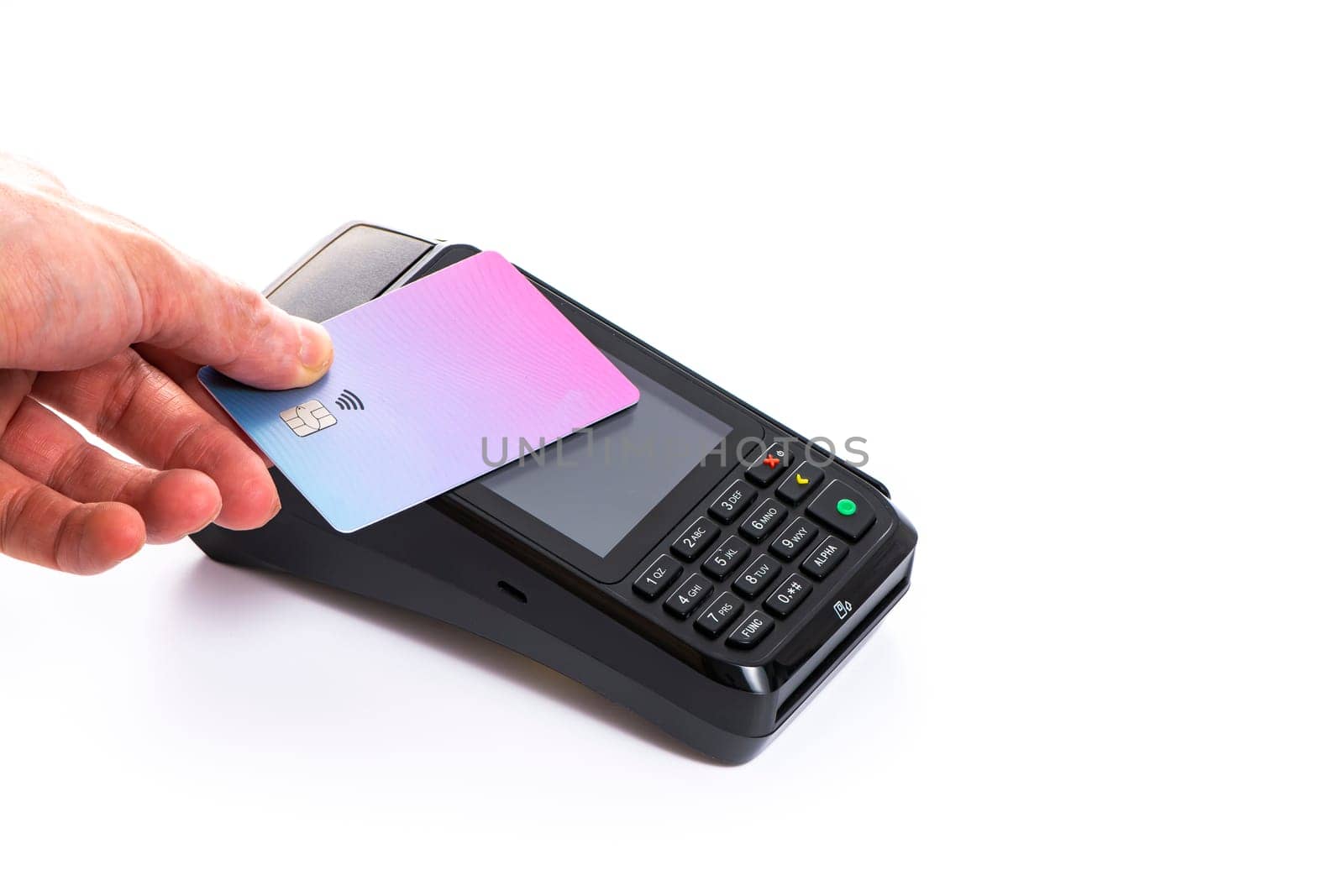 Attached plastic card to the payment terminal with a man's hand on a white isolated background, copy space. High quality photo