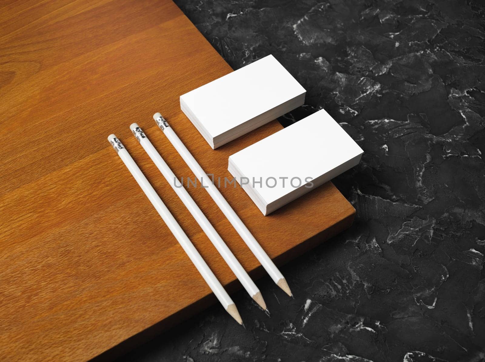 Blank stationery set on wooden board background. Blank business cards and pencils. Corporate identity template. Responsive design mockup.