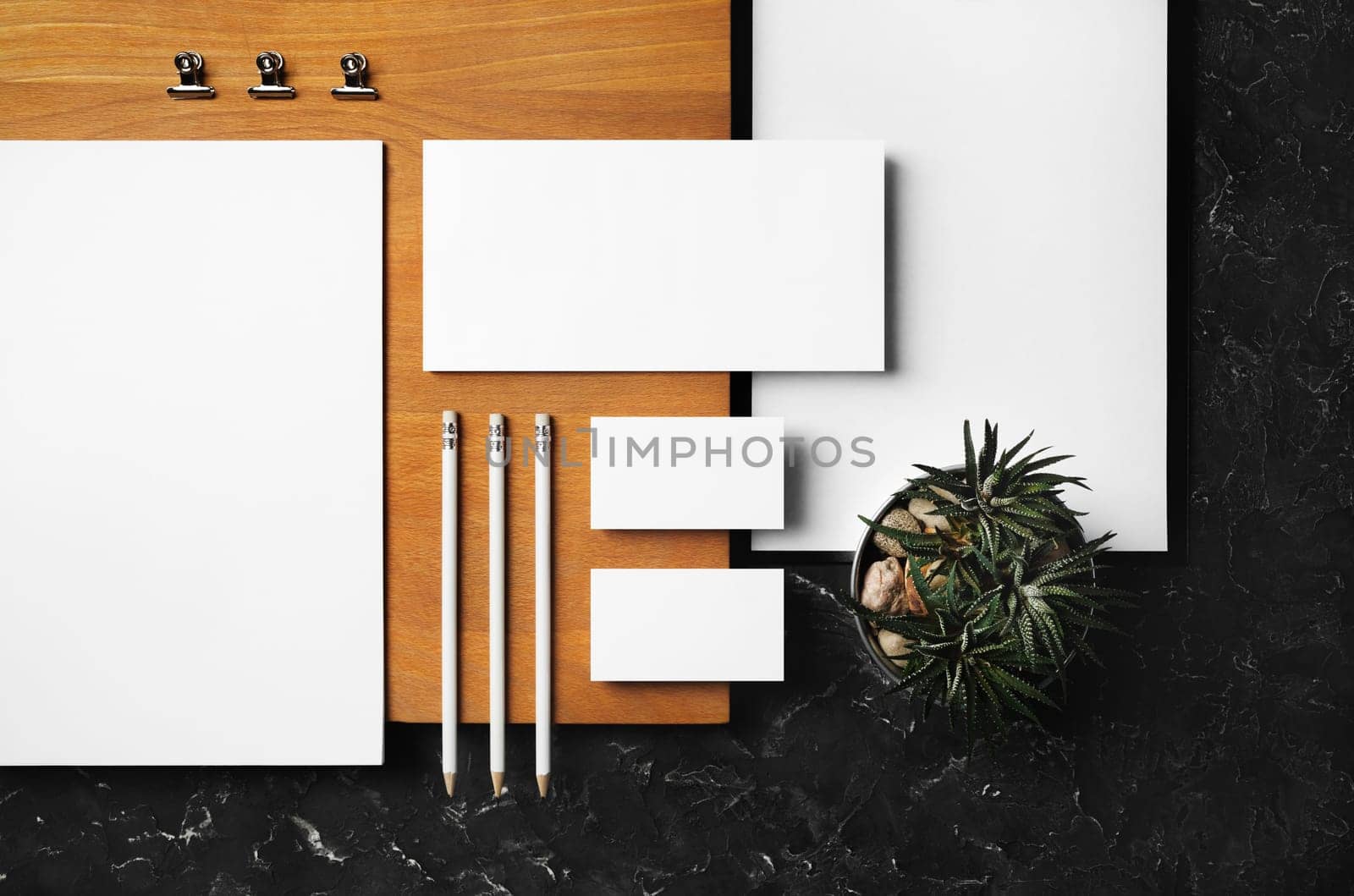 Blank stationery set and wooden board. ID template. Mockup for branding identity for designers. Flat lay.