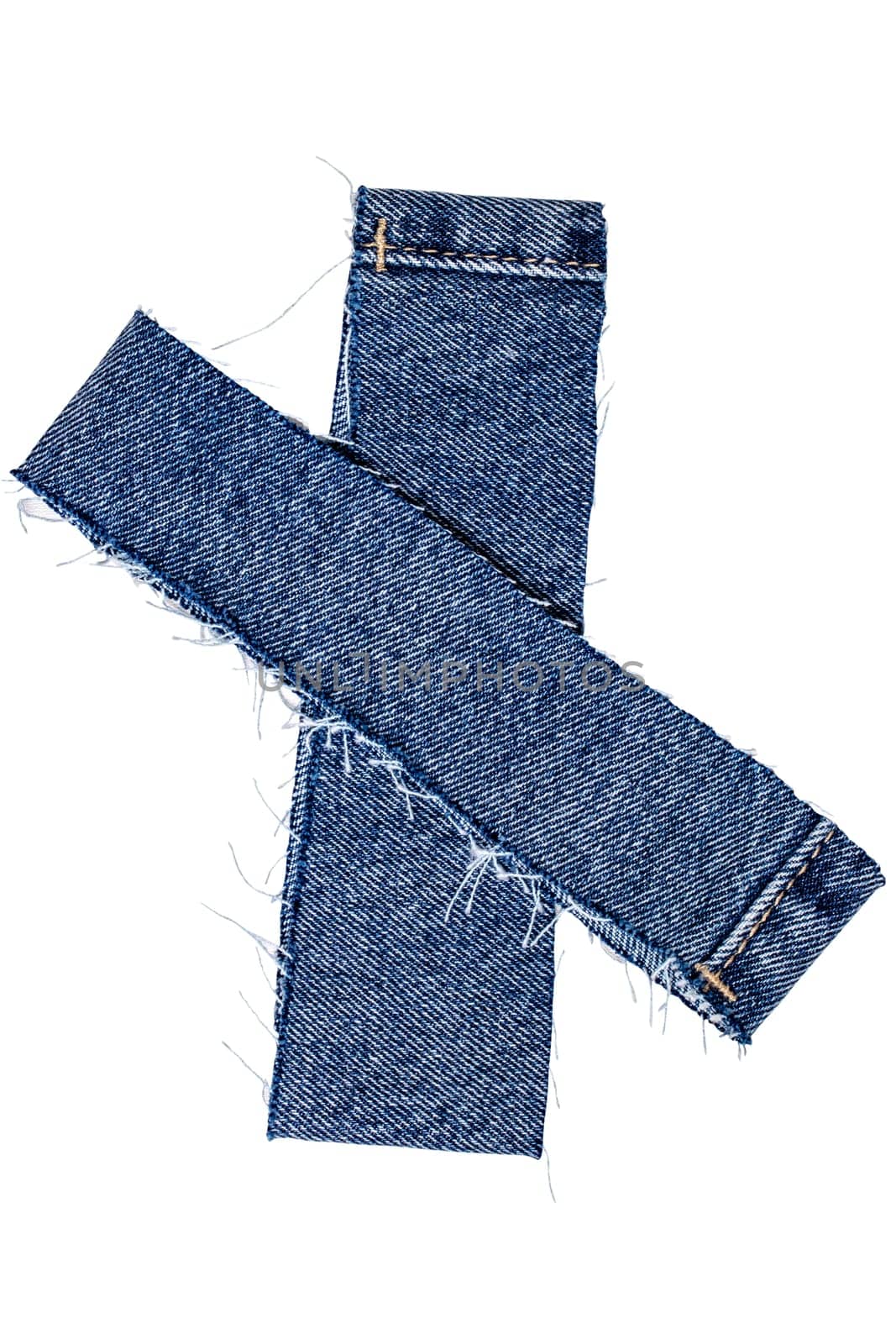 Closeup of two cut-off pant leg pieces of a blue denim jeans isolated on white background. Clipping path. Macro.