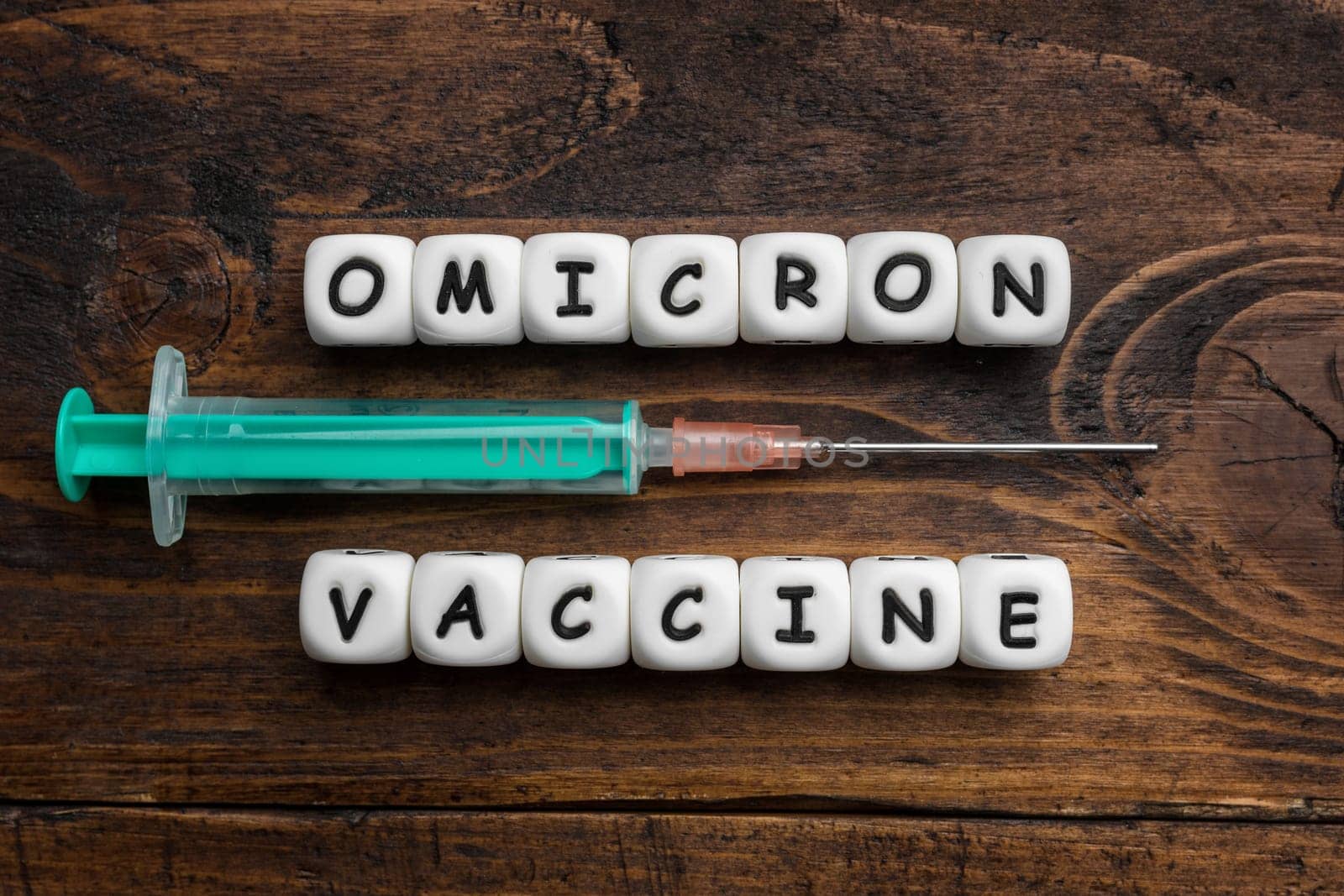 Corona virus Covid-19 vaccine text on wooden background