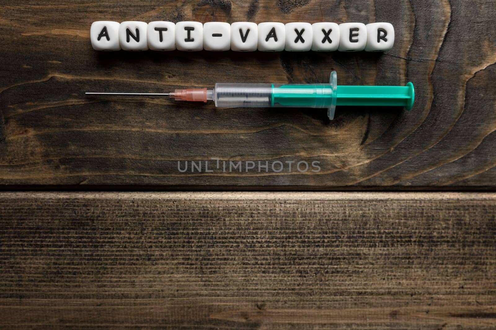 Corona virus Covid-19 vaccine text on wooden background