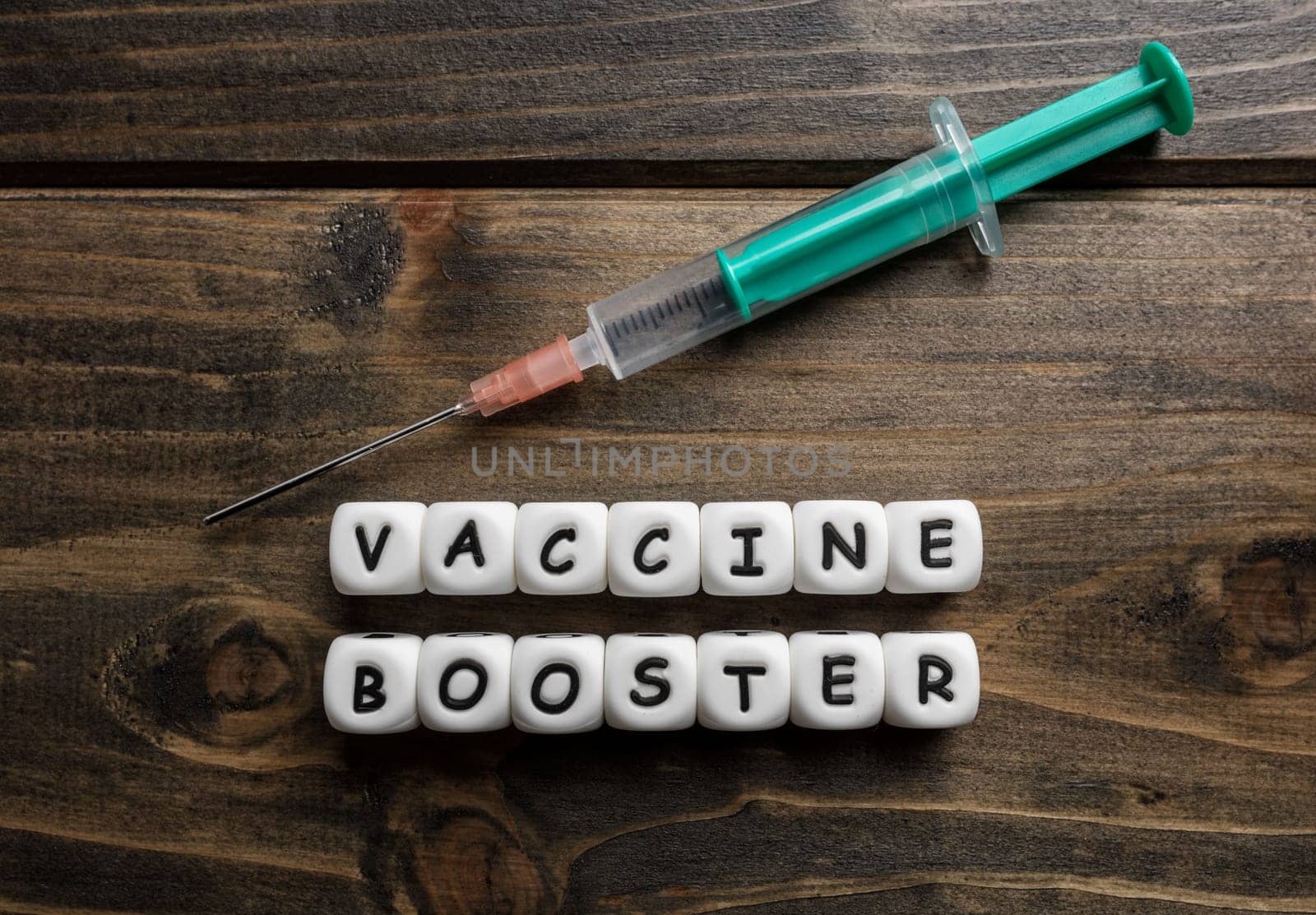 Corona virus Covid-19 vaccine text on wooden background
