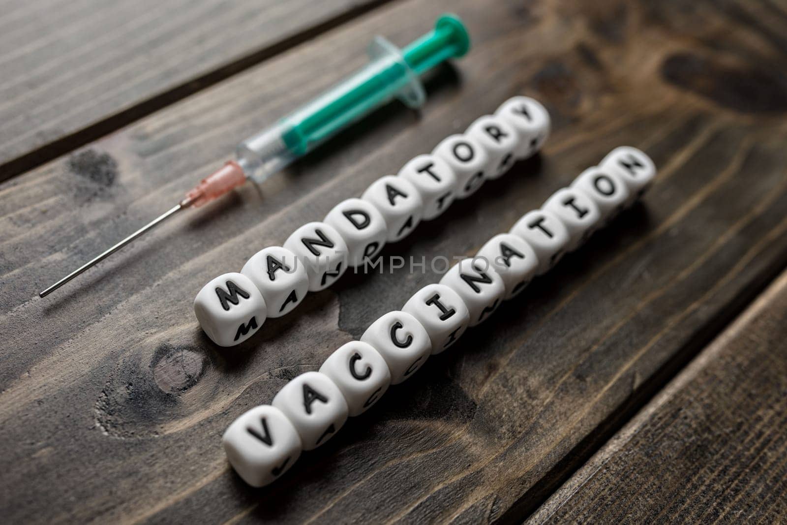 Corona virus Covid-19 vaccine text on wooden background