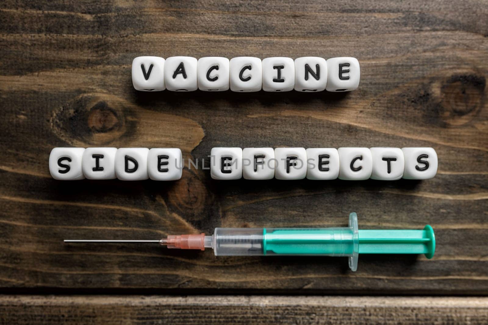 Corona virus Covid-19 vaccine text on wooden background