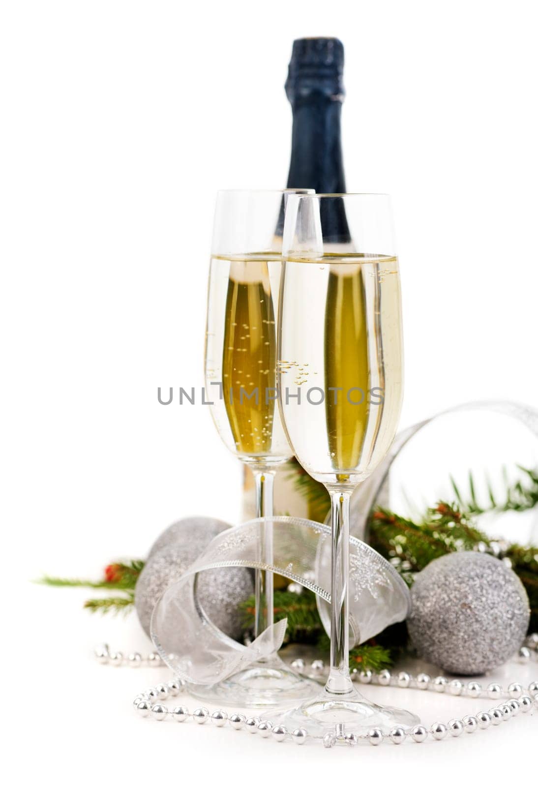 Champagne and christmas decoration over white background