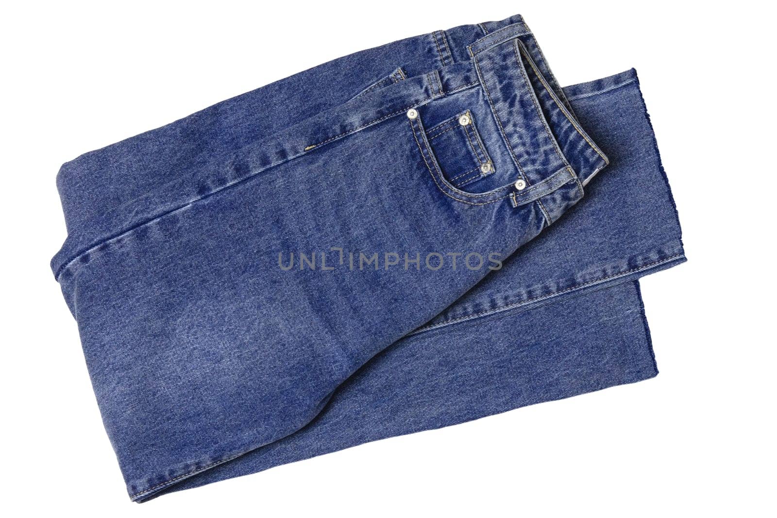 Woman jeans isolated. Folded trendy stylish female blue jeans trousers isolated on a white background. Fashionable denim pants for women.