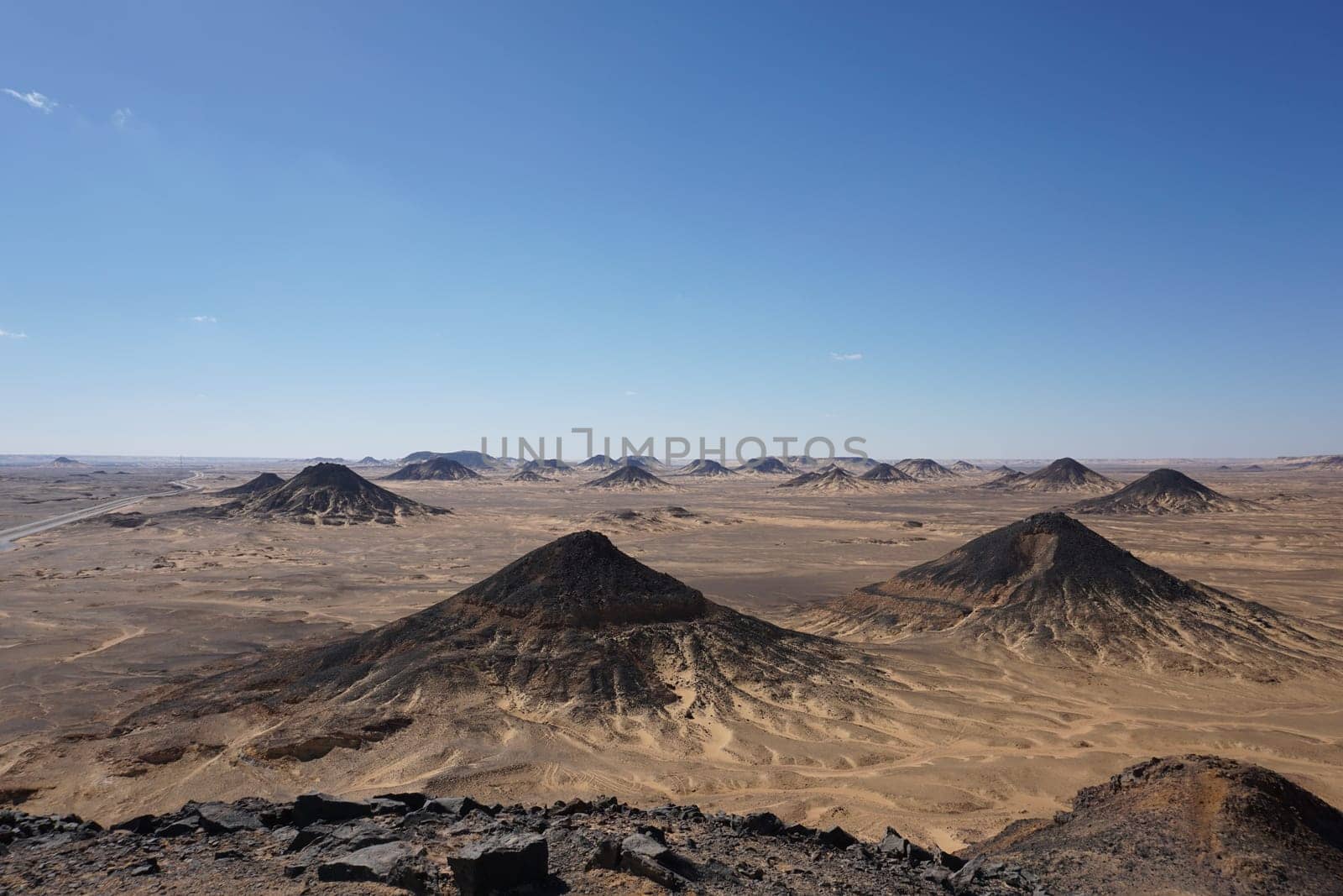 Pitch black hills of the black dessert on a tour to black and white desert, Egypt