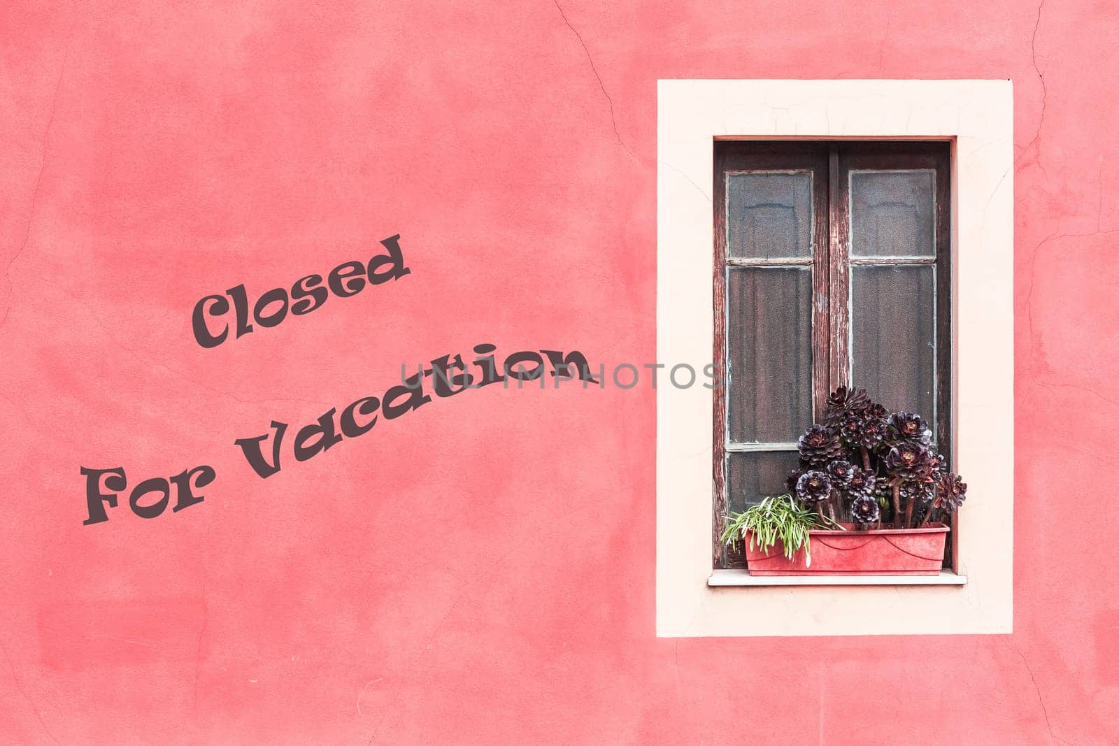 Closed window with planter  and red wall. Closed for vacation