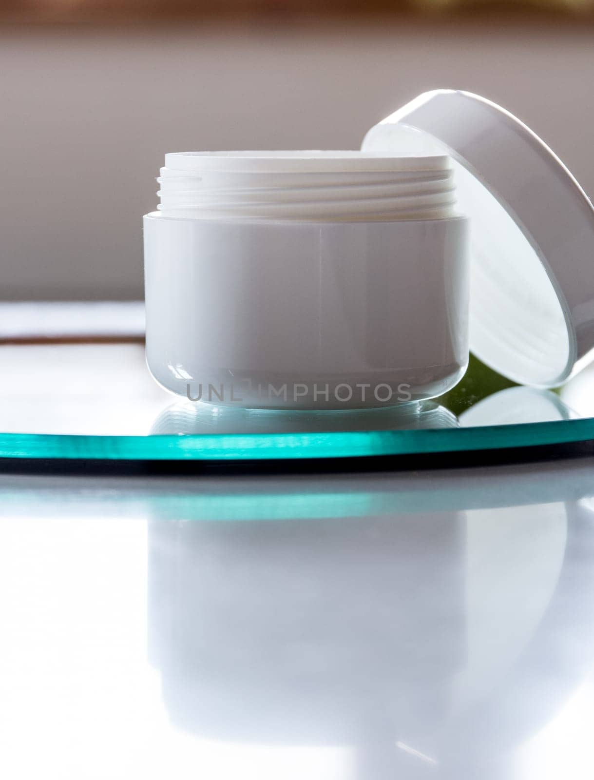 Empty cream tin,open