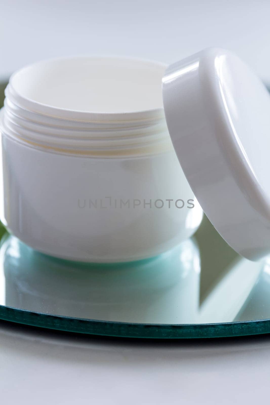 Empty cream tin,open