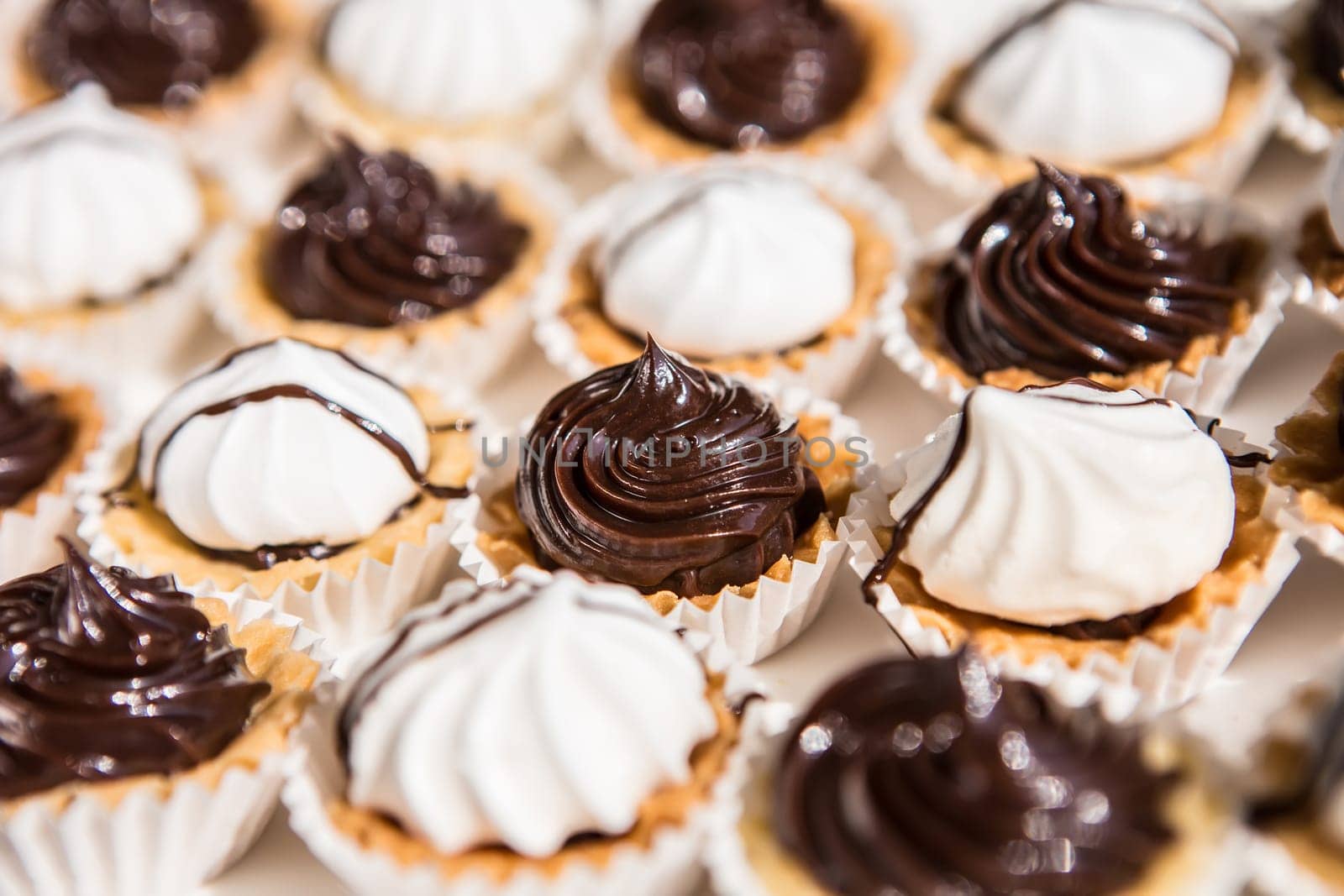 white and black meringue cookies. Creative background