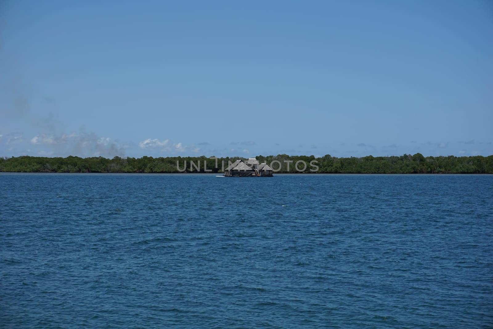 Floating bar with Manda Island in the background, Lamu Island, Kenya