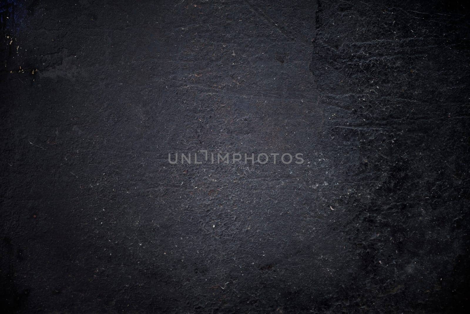 Grungy black textured metal background