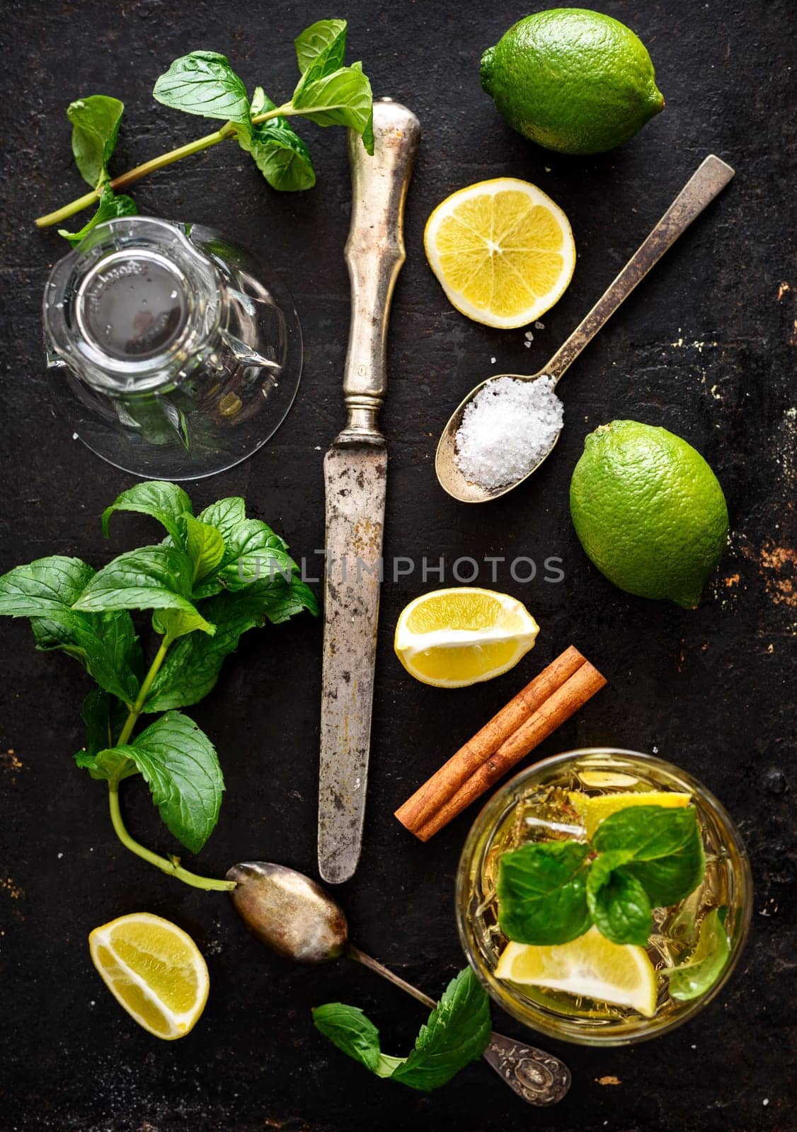 mojito ingredients on rustic black background