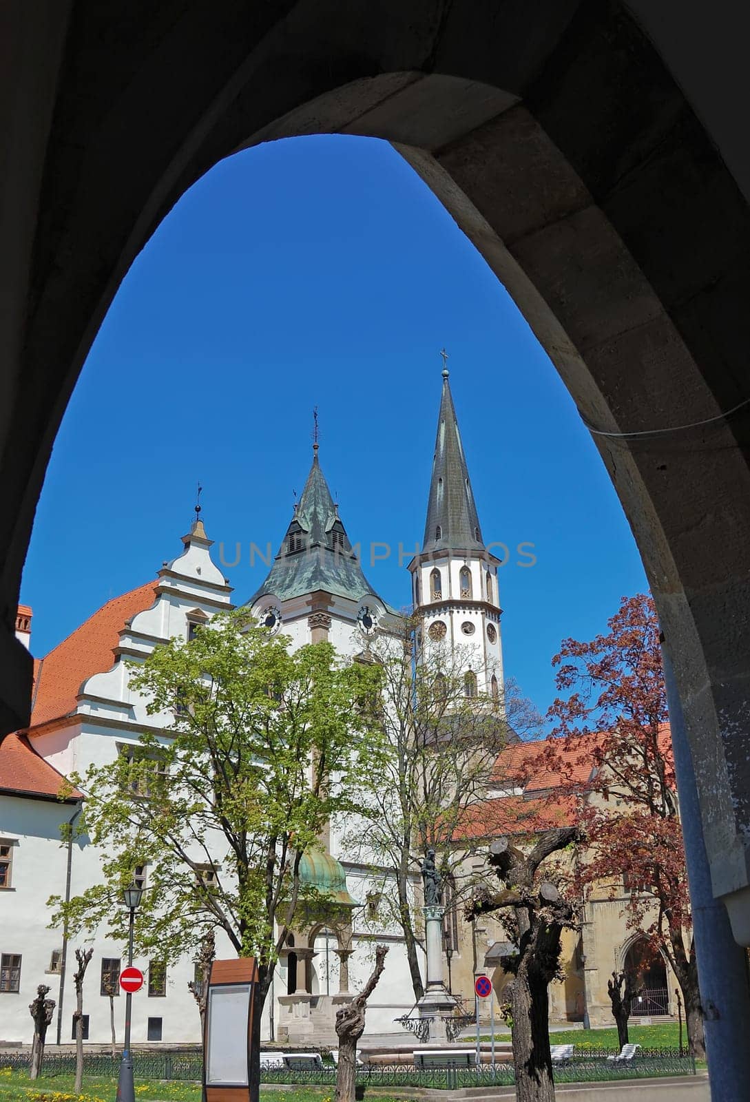 Medieval Town Hall with Bell Tower and church in Levoca, Slovakia