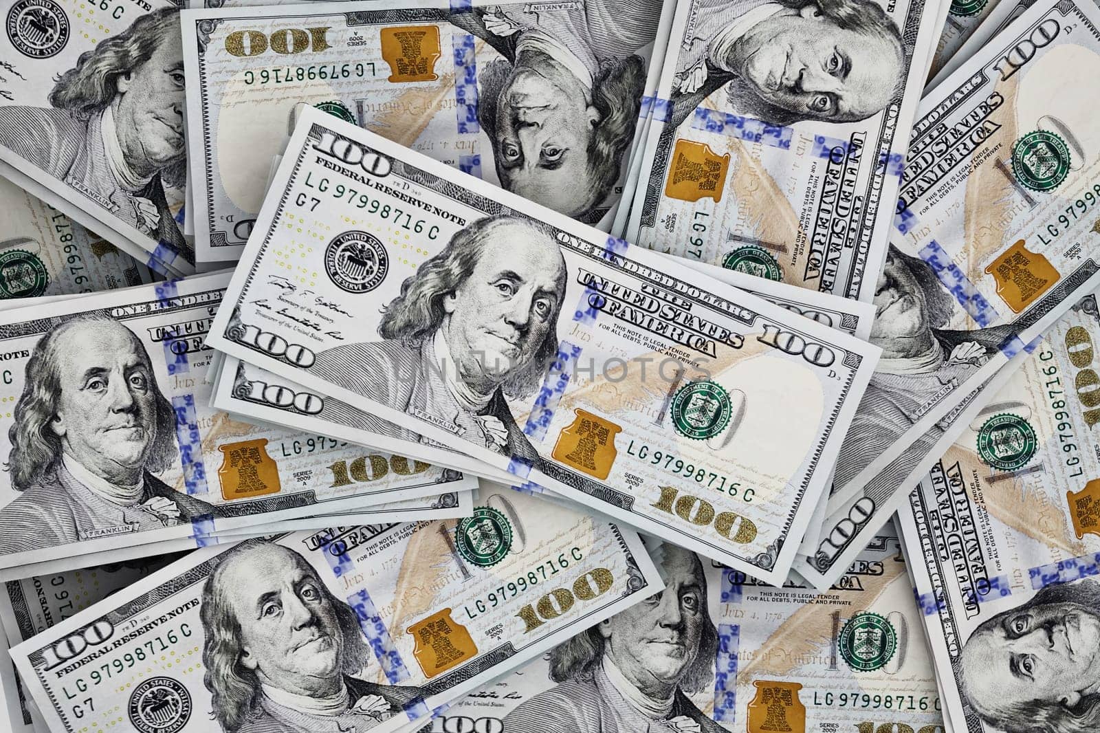 Stack of scattered 100 dollar bills. 3D illustration.