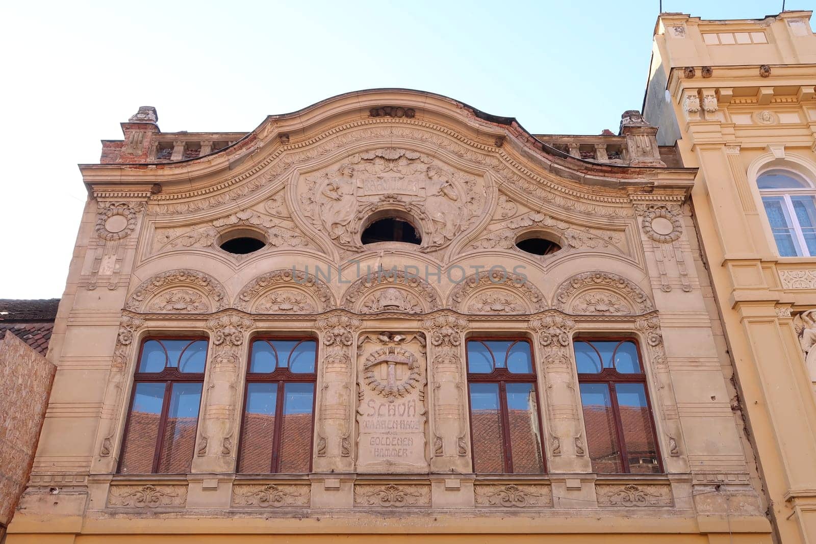 Art nouveau, Jugendstil facade of a house in Brasov with german inscriptions, Romania 2021