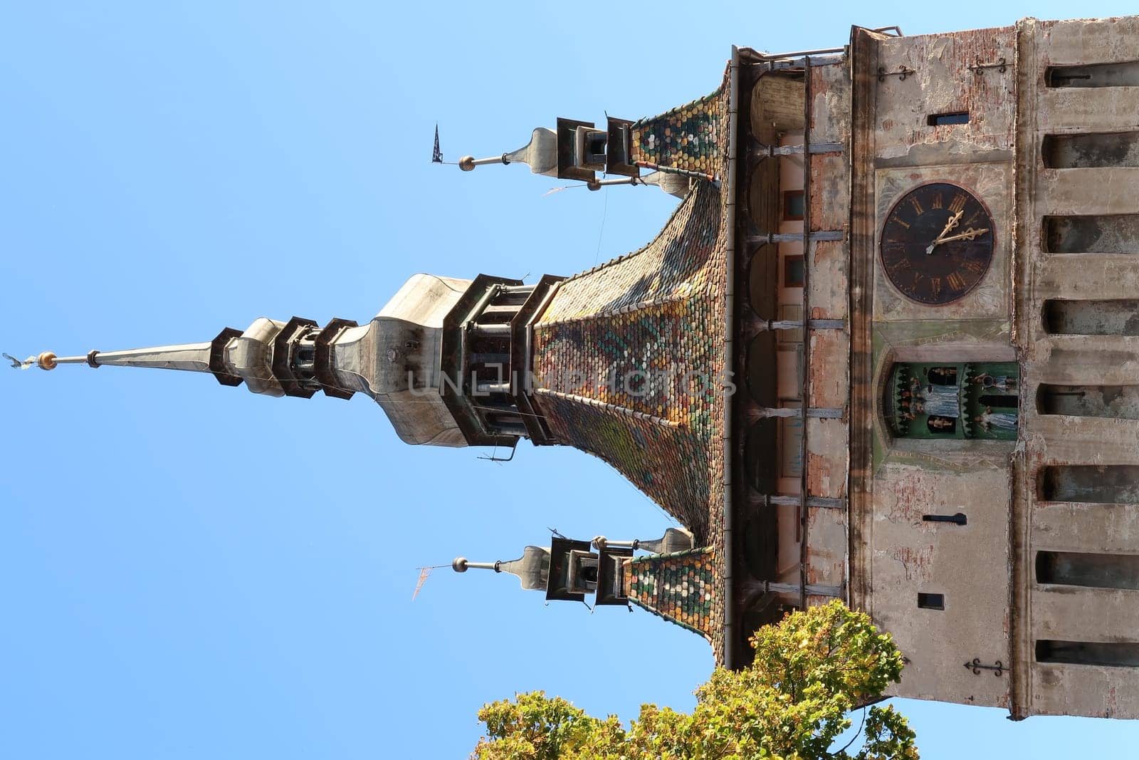 Closeup on Sighisoaras famous Clock Tower from inside of the Citadel, Romania 2021