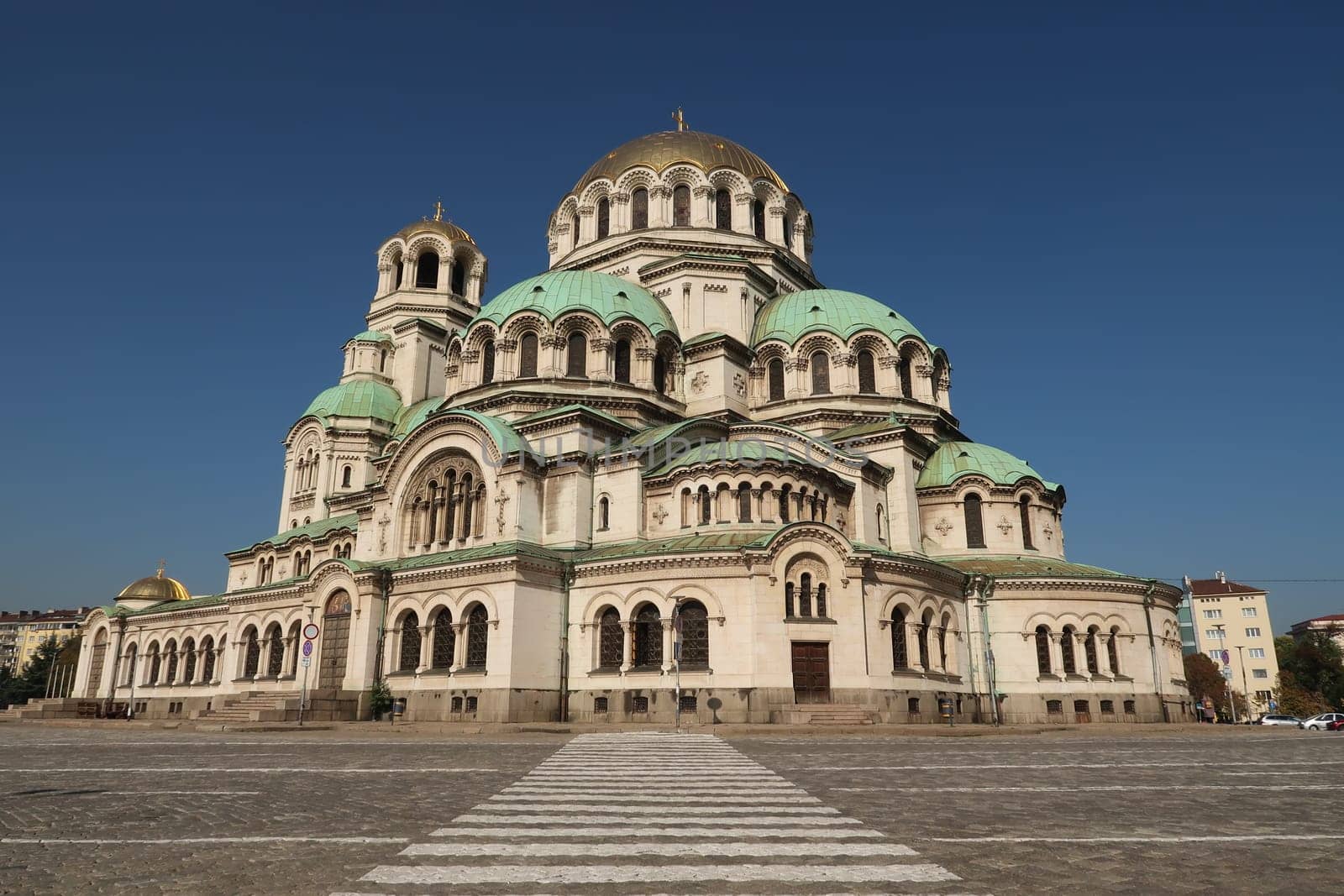 View onto the St. Alexander Nevsky Cathedral in Sofia with a crosswalk in the front, Bulgaria 2021