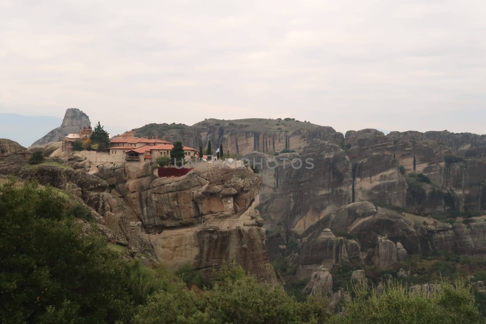 View onto the Monastery of the Holy Trinity from a distance, Meteora, Greece 2021