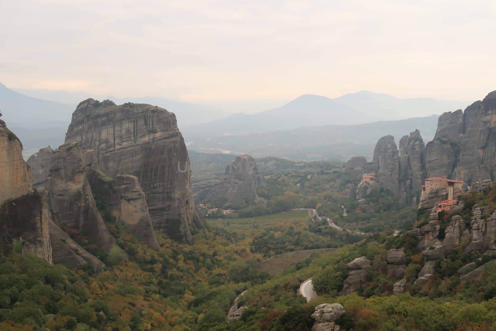 Spectacular view onto Monasteries of St. Nicholas Anapafsas, Roussanou surrounded by rock pillars, Meteora, Greece 2021