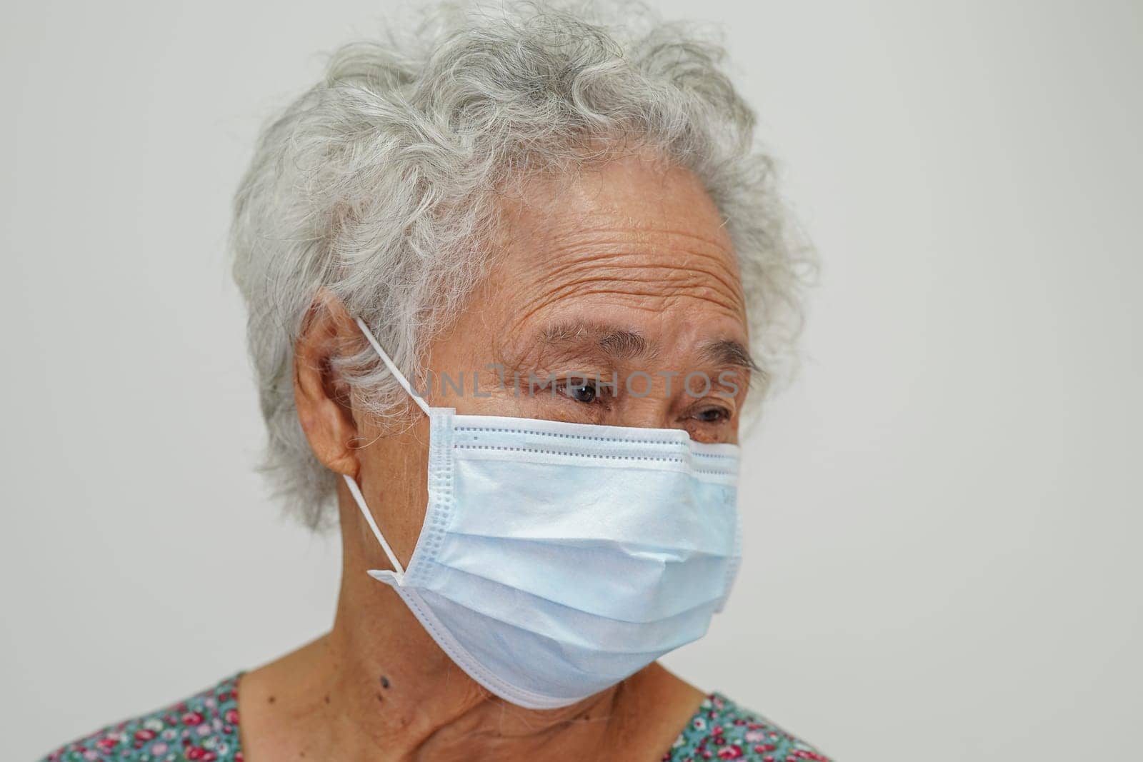 Asian elder senior woman patient sitting and smile face with happy on bed in hospital.