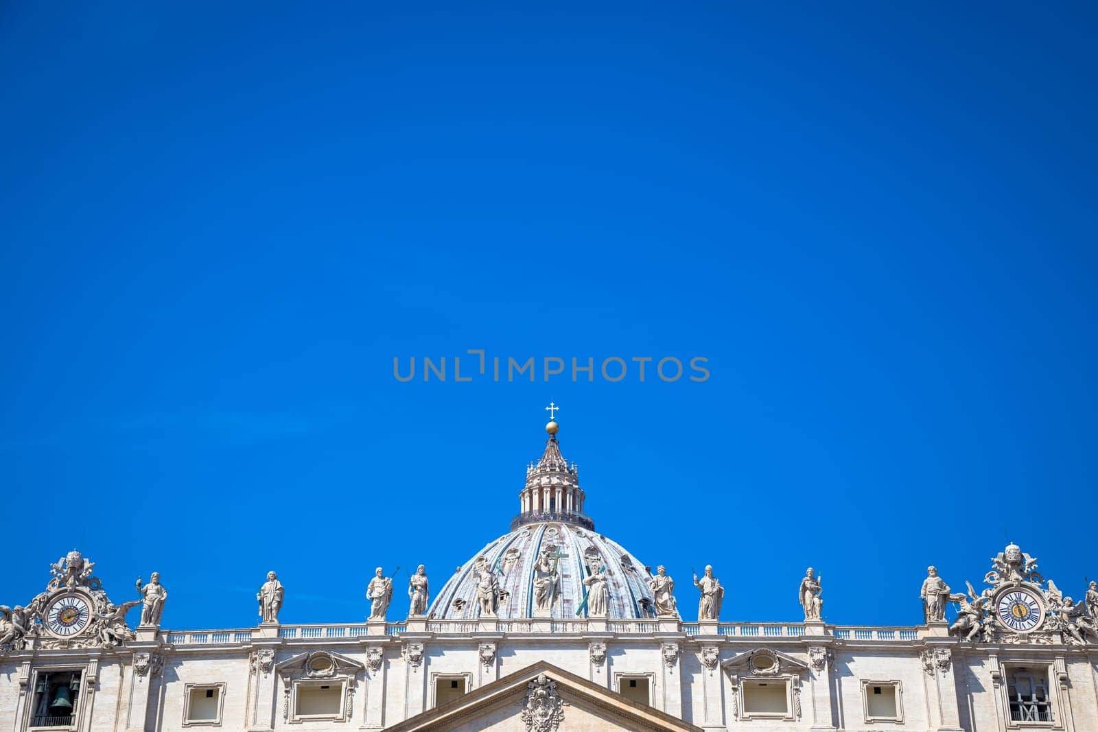 St Peter Basilica detail with a blue sky background for copy space - Rome, Vatican State