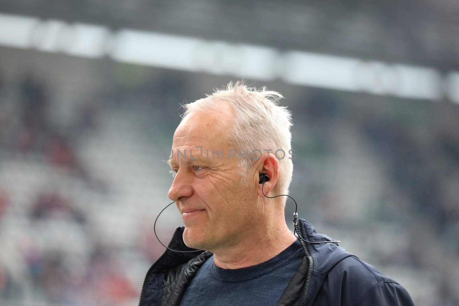 Coach Christian Streich (Freiburg) laughs during the TV interview before the game of the 1st FBL: 21-22: 31st Sptg. SC Freiburg vs Borussia Mönchengladbach... DFL REGULATIONS PROHIBIT ANY USE OF PHOTOGRAPHS AS IMAGE SEQUENCES AND/OR QUASI-VIDEONann.. Photo: Joachim Hahne/johapress