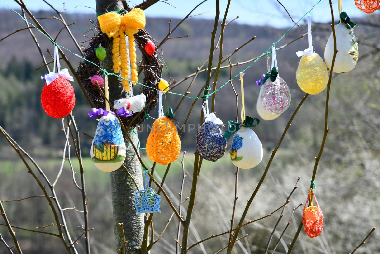 Rural woman decorate an Easter tree