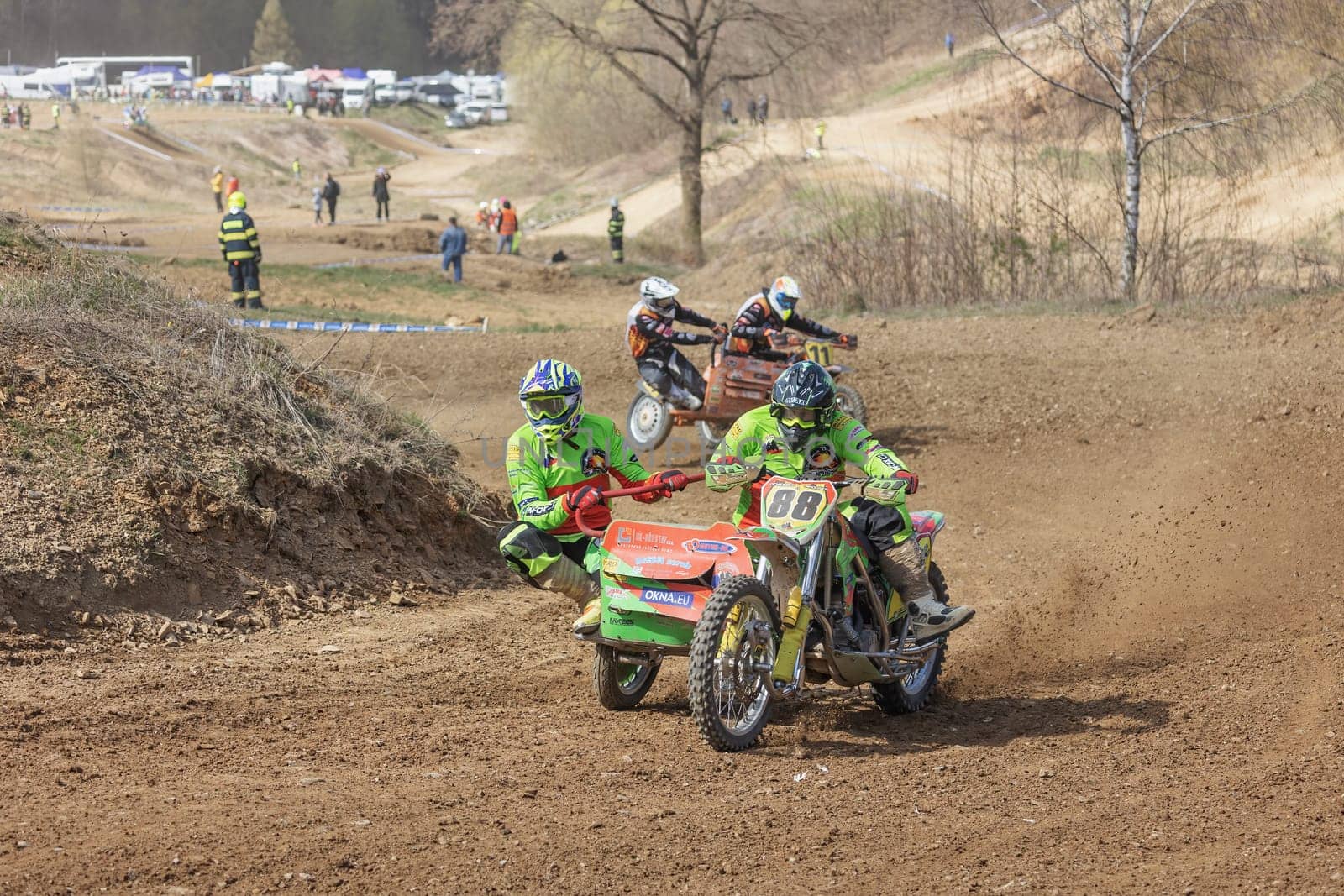 MOHELNICE, CZECH REPUBLIC - APRIL 16, 2022. Two sidecarcross bike in the turn in difficult terrain in the "Sidecarcross Championship of Czech Republic"" on April 16, 2022 in the town of Mohelnice. CR"