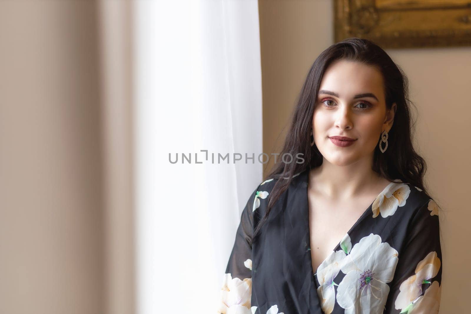 Front view portrait of atractive dark haired girl.  Horizontally.